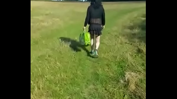 gay crossdresser takes a walk in public dressed up like a girl but soon runs away when he hears two people near by
