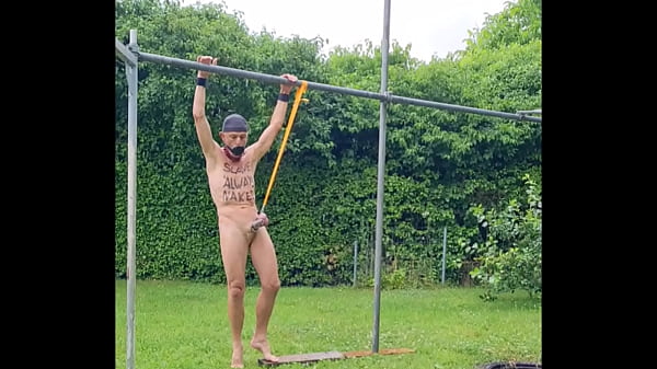 naked slave pig exposed in penis cage, outdoor during rain, tied up at my testicles, humiliating bodywriting, BDSM CBT