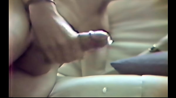 Skinny twink jerks long cock on sofa