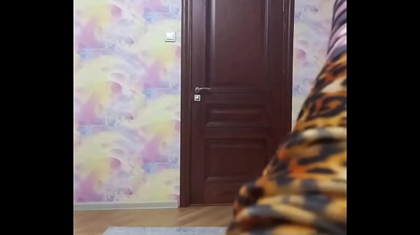 Crossdresser smokes and poses in long tight dress