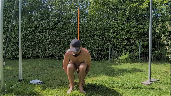 naked pathetic slave in penis cage outdoor tied up at his testicles enjoy the BDSM party with dildo in gay ass, CMNM