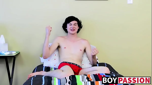 Twink tugs on his massive cock and uses dildo on his ass