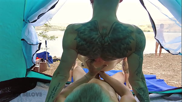 A couple of hot guys have wild sex on a public beach, causing vacationers to react aggressively to them