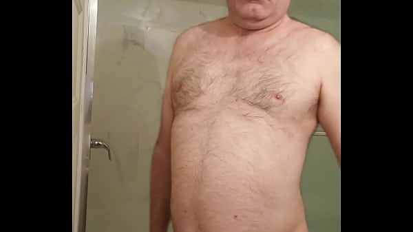 Nude Martin Lavallée installs his transparent cock cage over his small penis and compares it with his 10 inch dildo